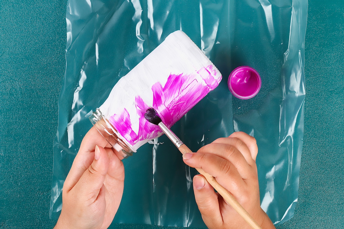 Painting-a-mason-jar-with-pink-paint