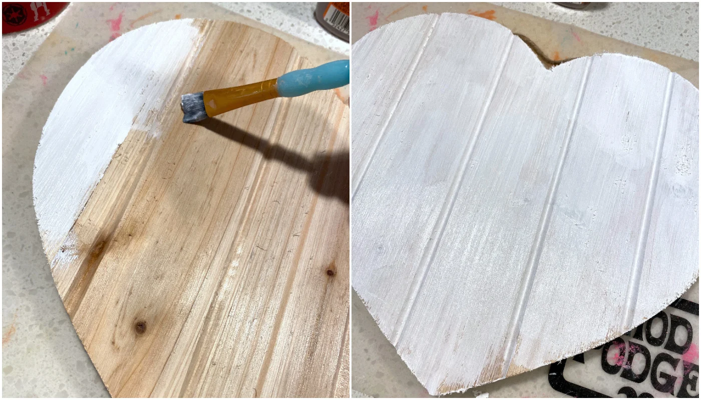 Painting a heart pallet with white paint
