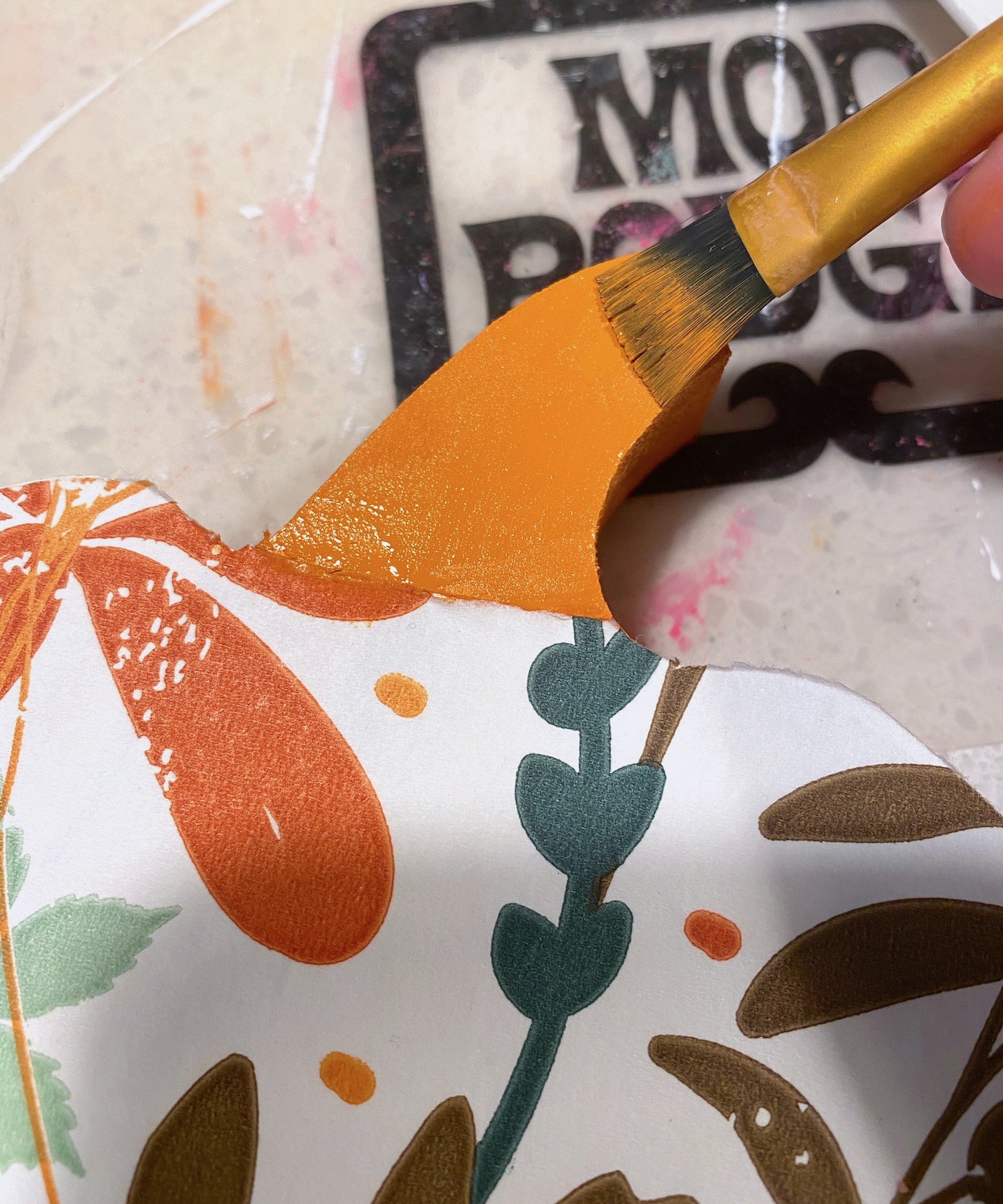Painting the stem with orange craft paint