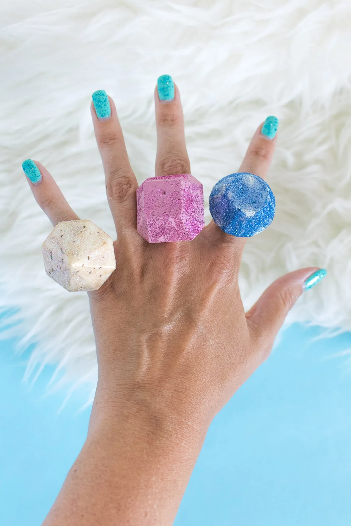 DIY gem rings made with hot glue on a hand