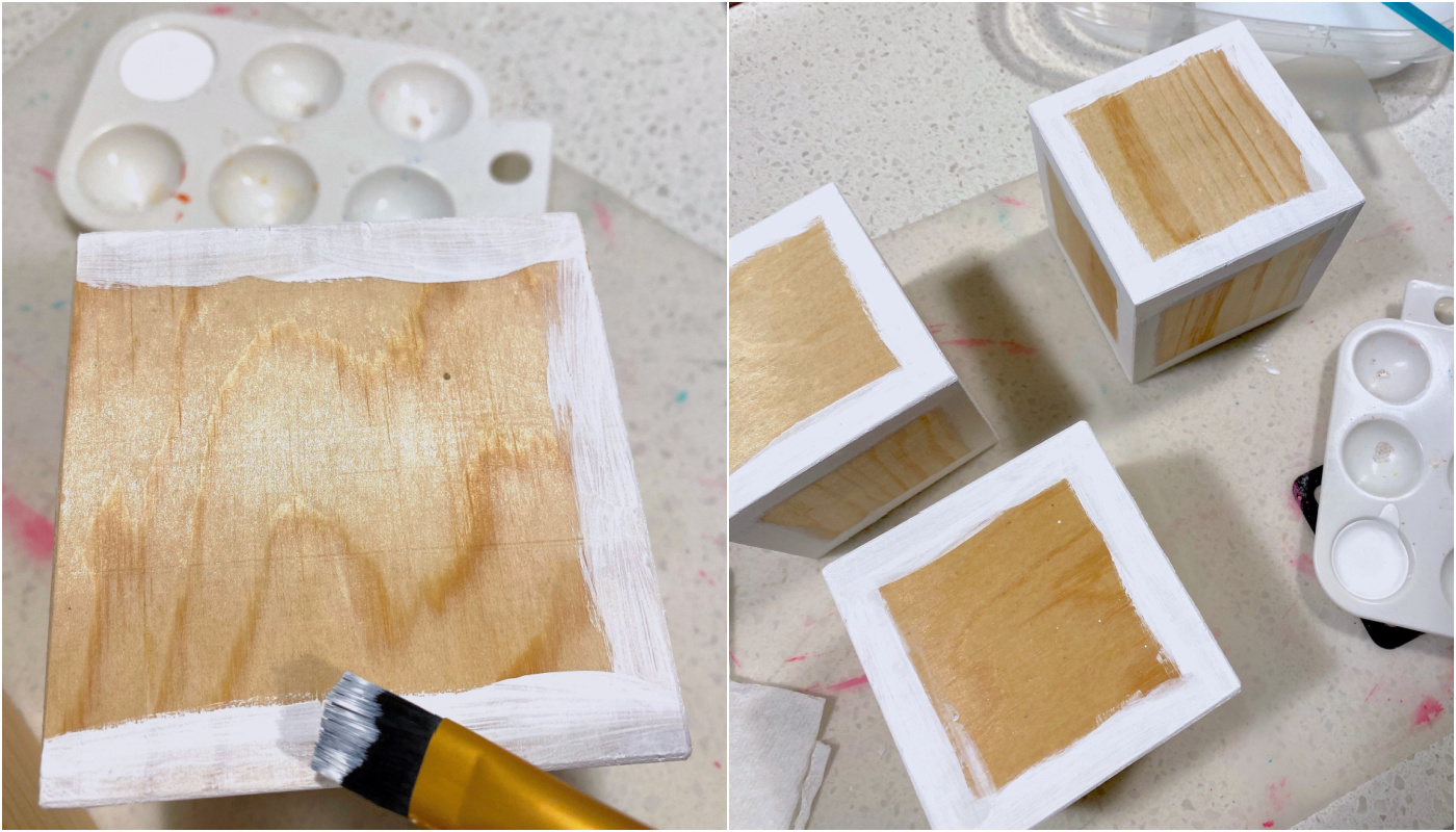 Painting the edges of the wood blocks with white craft paint