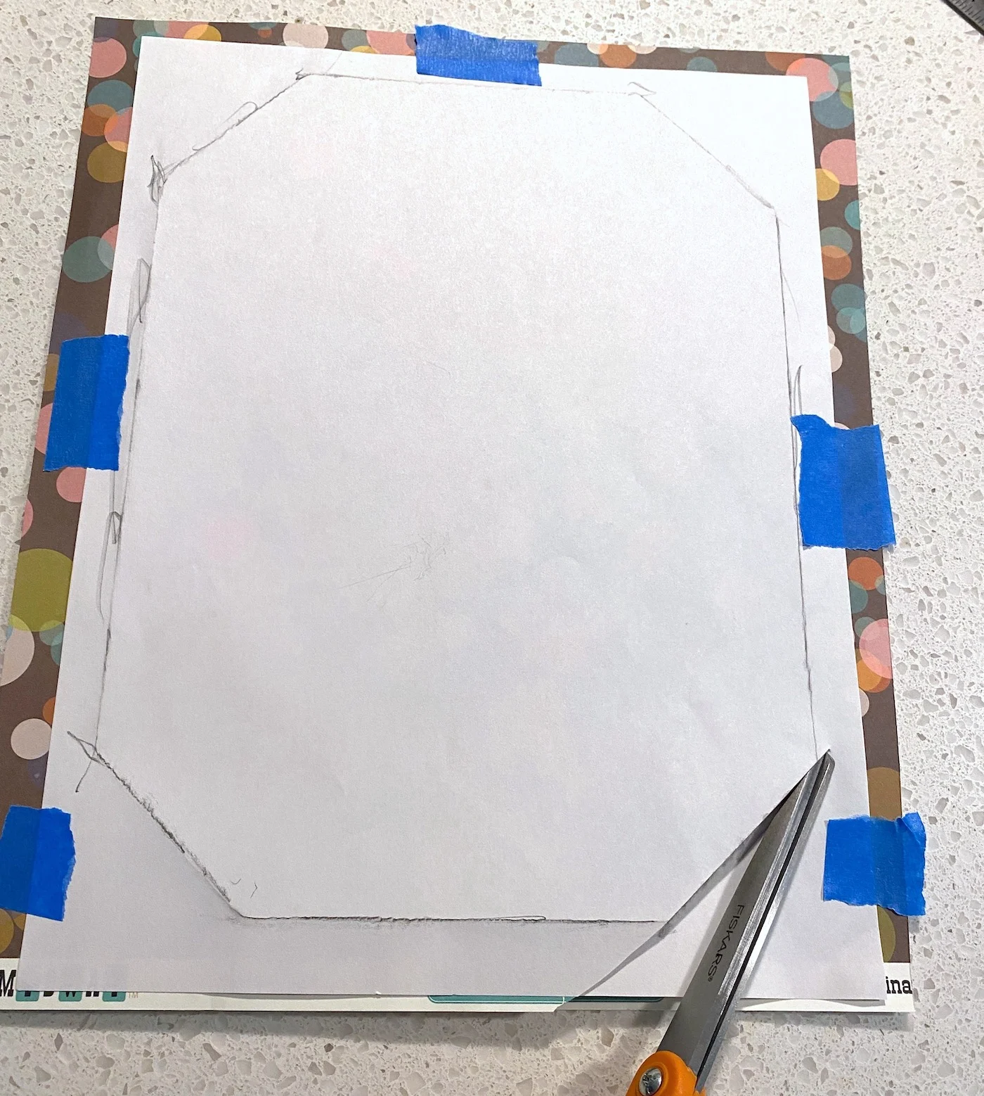 Cutting the pattern out of scrapbook paper