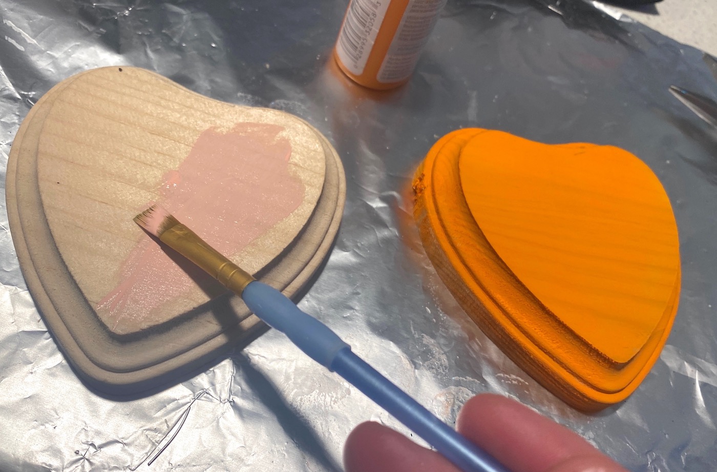Painting a heart with pink craft paint