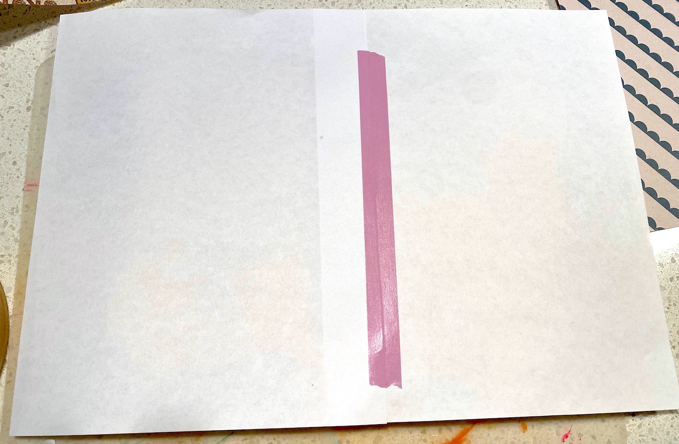 Two pieces of paper taped together with washi tape