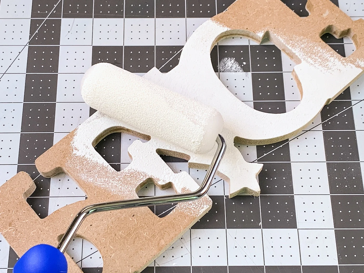 Painting an MDF word with white paint