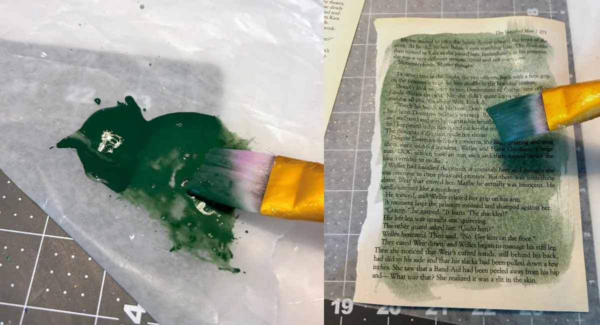 painting a dark green wash over the top of one of the book pages