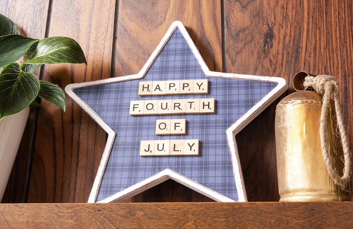 Decorating a wood star for Independence Day