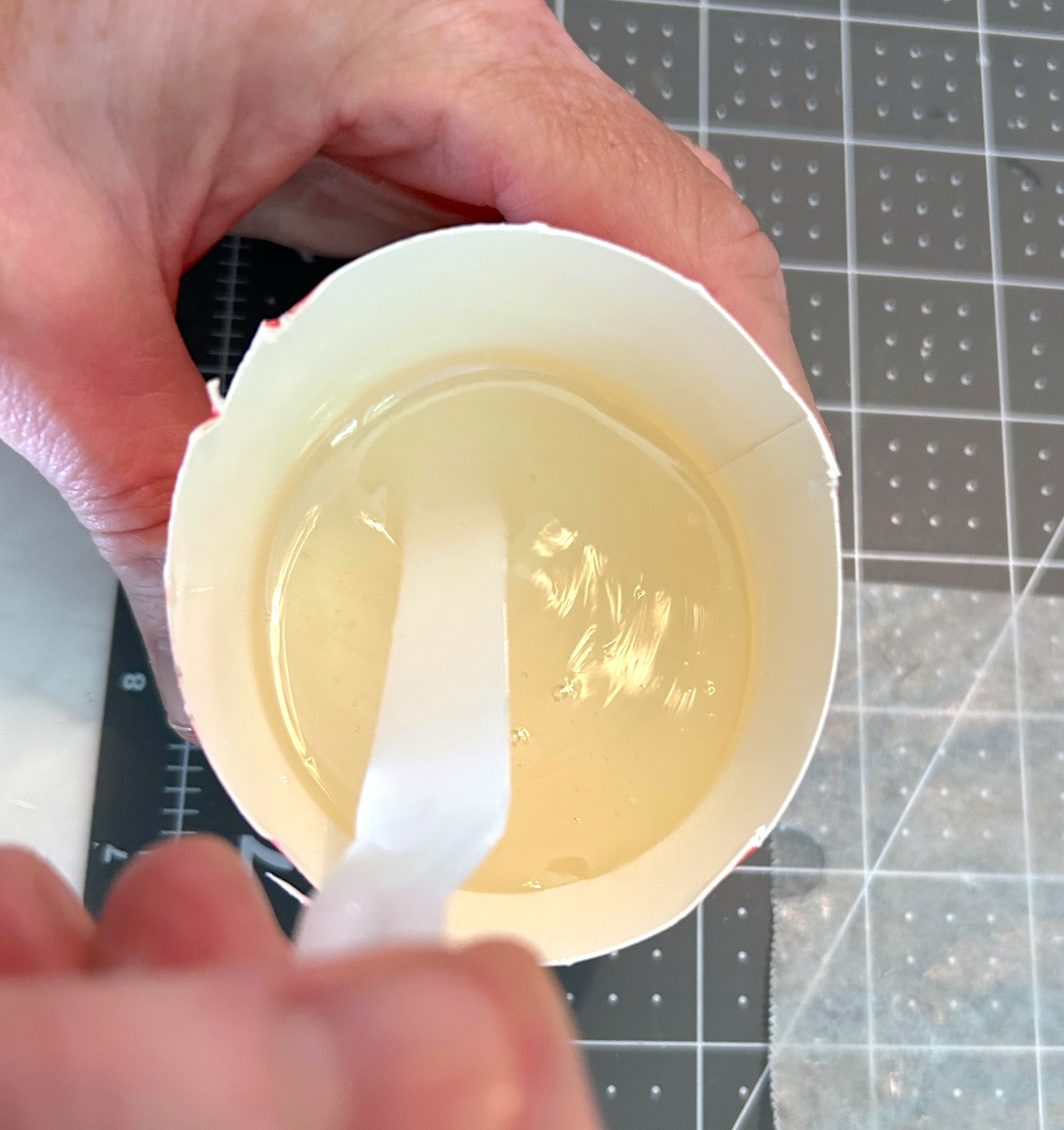 Mixing resin in a small paper cup