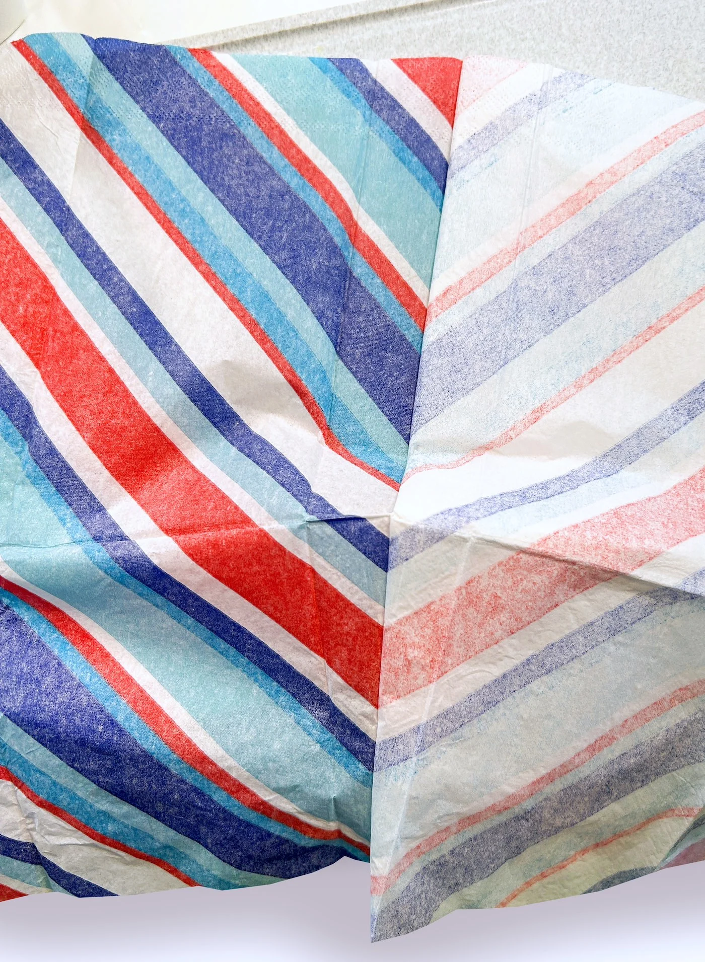 Separating a red, blue, and white striped napkin