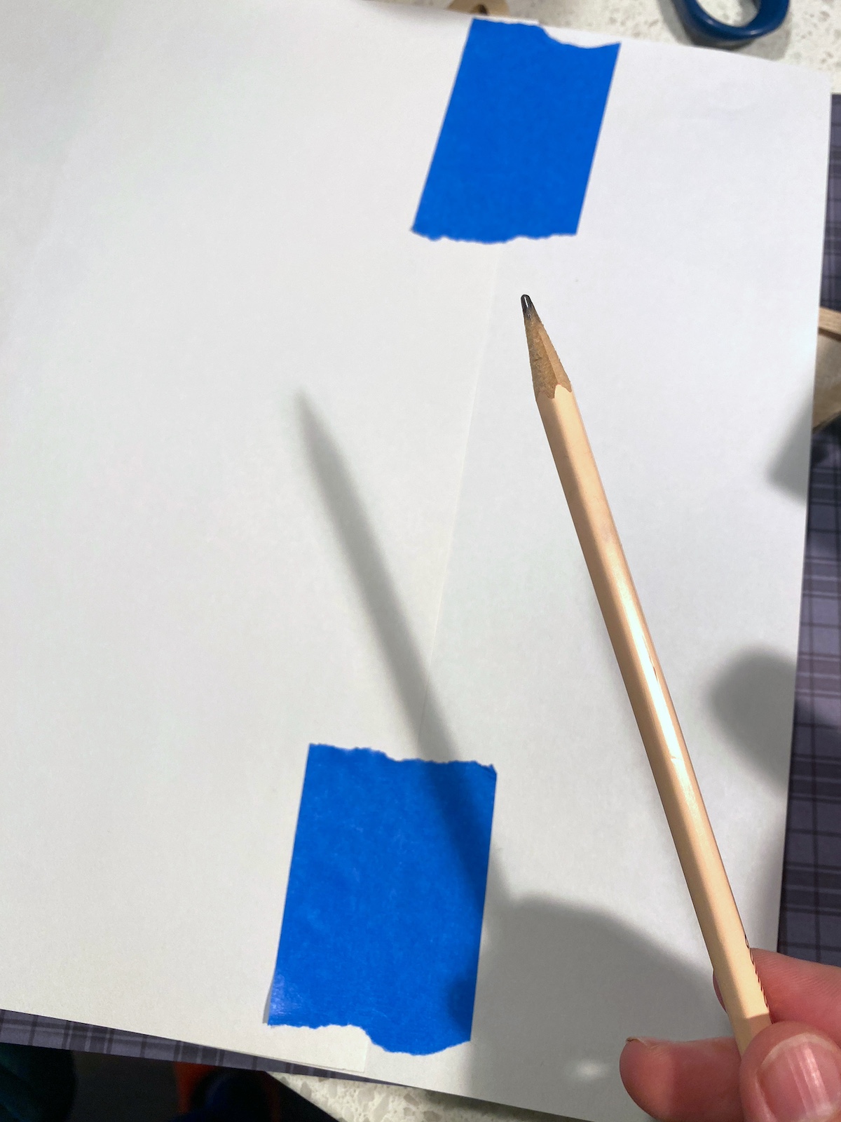 Two pieces of printer paper taped together with painter's tape