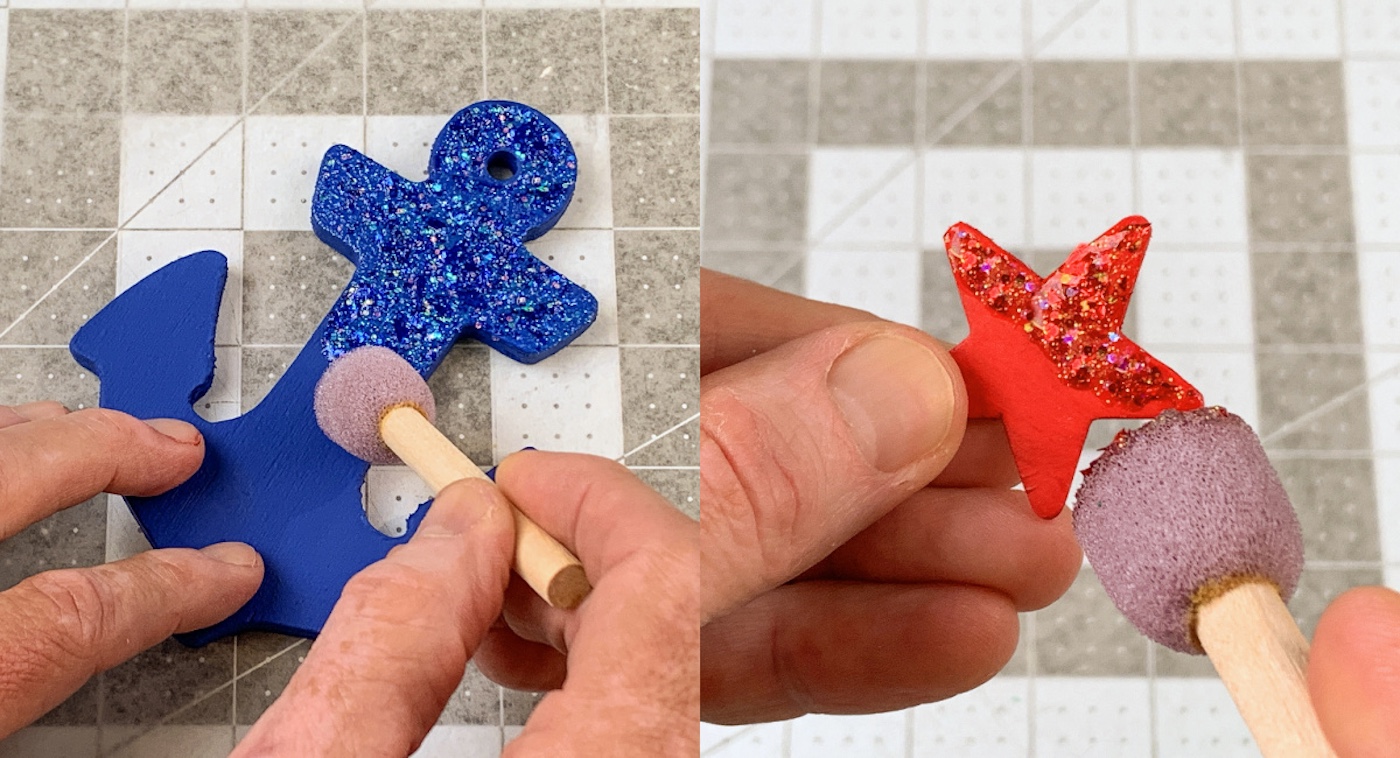 painting the blue anchor with blue glitter paint and the red star with red glitter paint