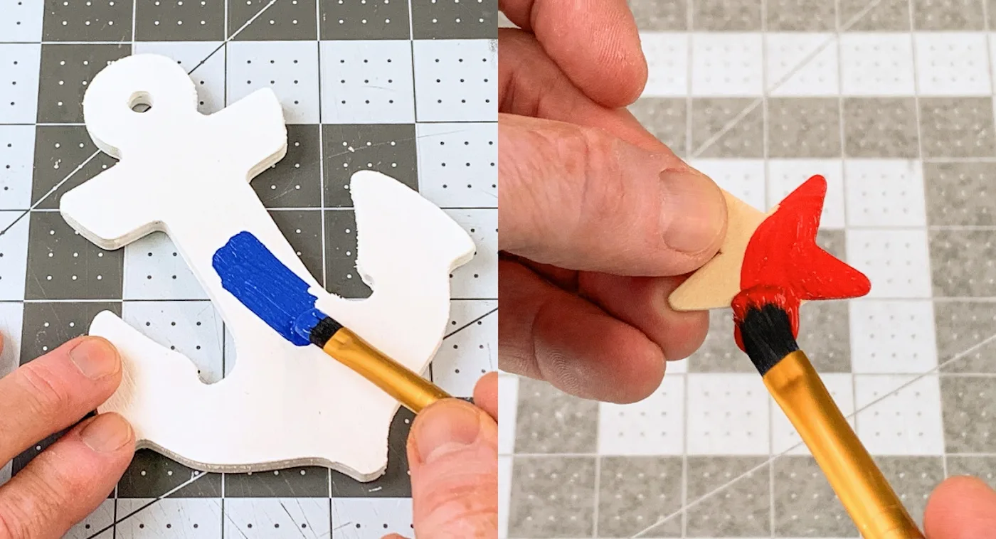 painting the small wood anchor with blue paint and the small red star with red paint