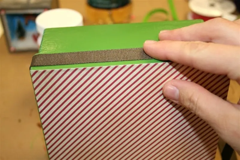 Gluing ribbon around edges of the boxes