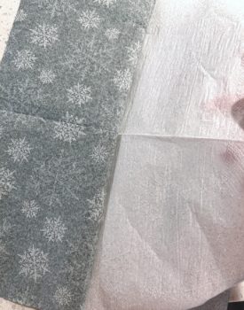 Separating the winter napkin with snowflakes