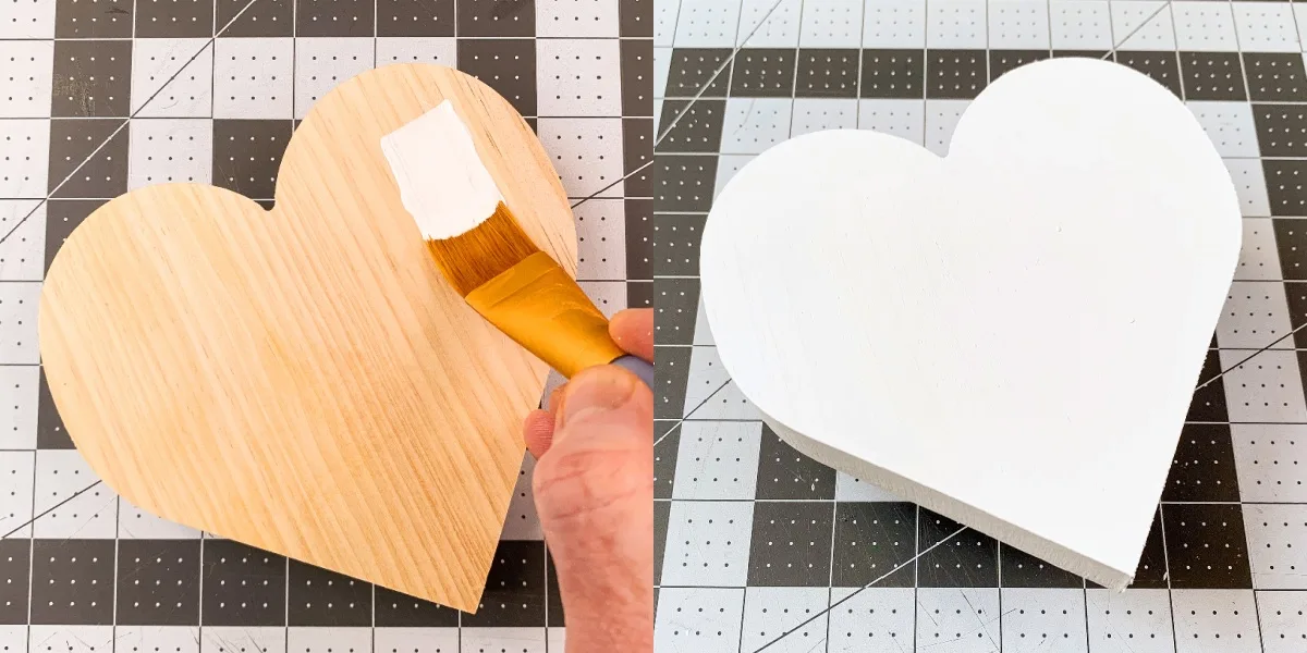 painting a chunky wood heart with white paint