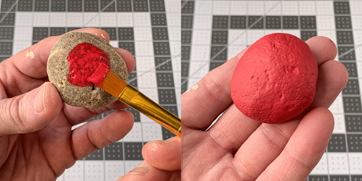 Painting the top rock with red craft paint
