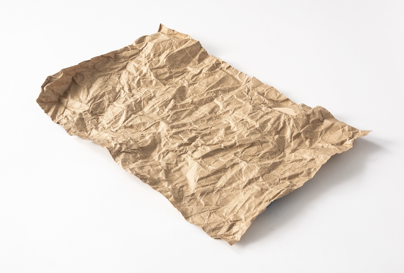Piece of wrinkled paper bag on a surface
