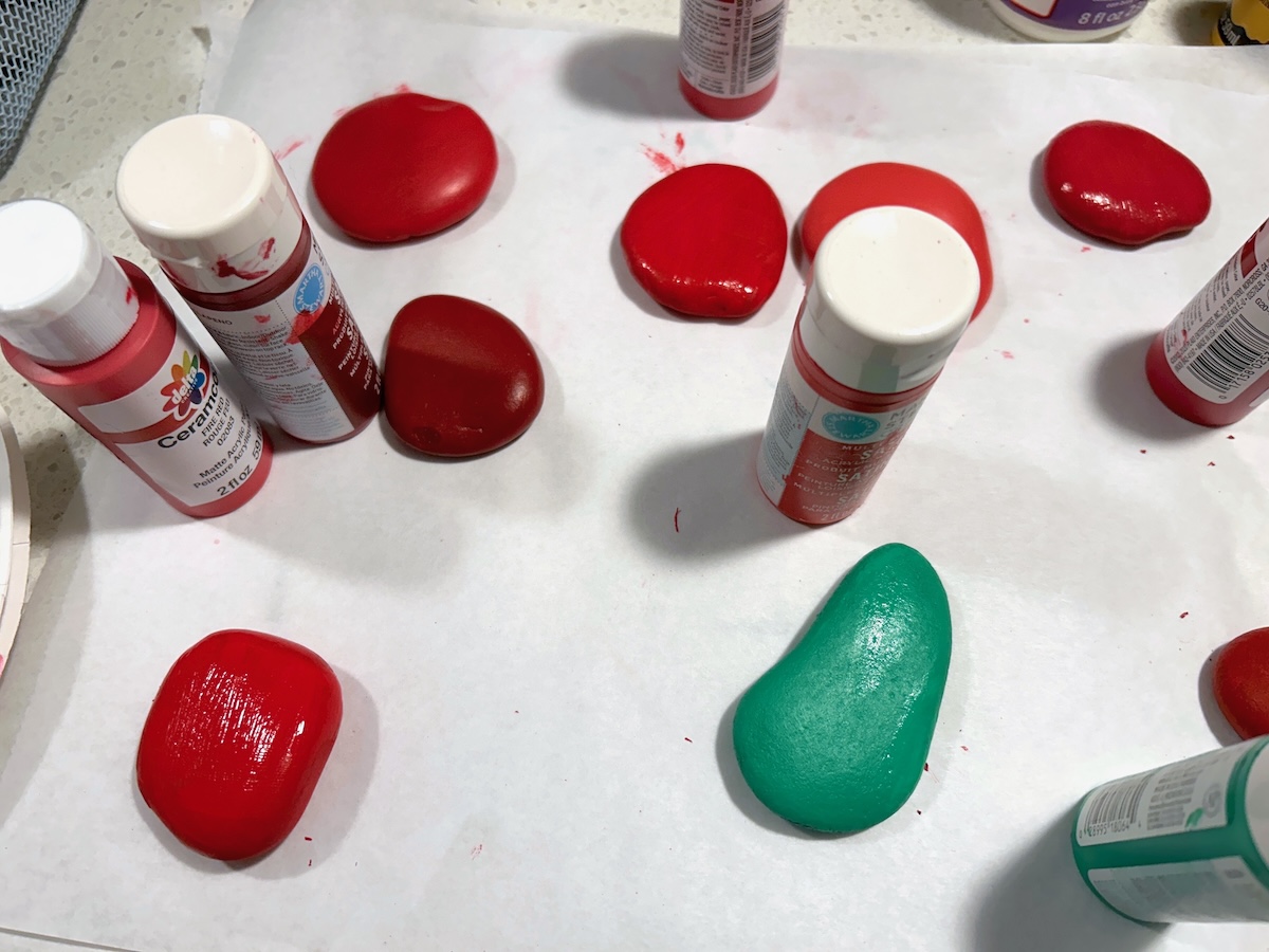 Painting the other side of the round rocks with red