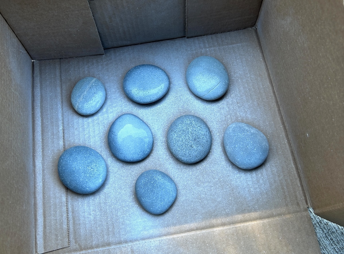 Rocks sprayed with white primer