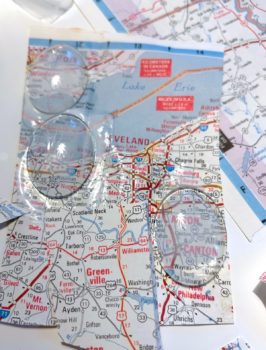 glass domes glued to a map