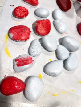 painting rocks with red paint